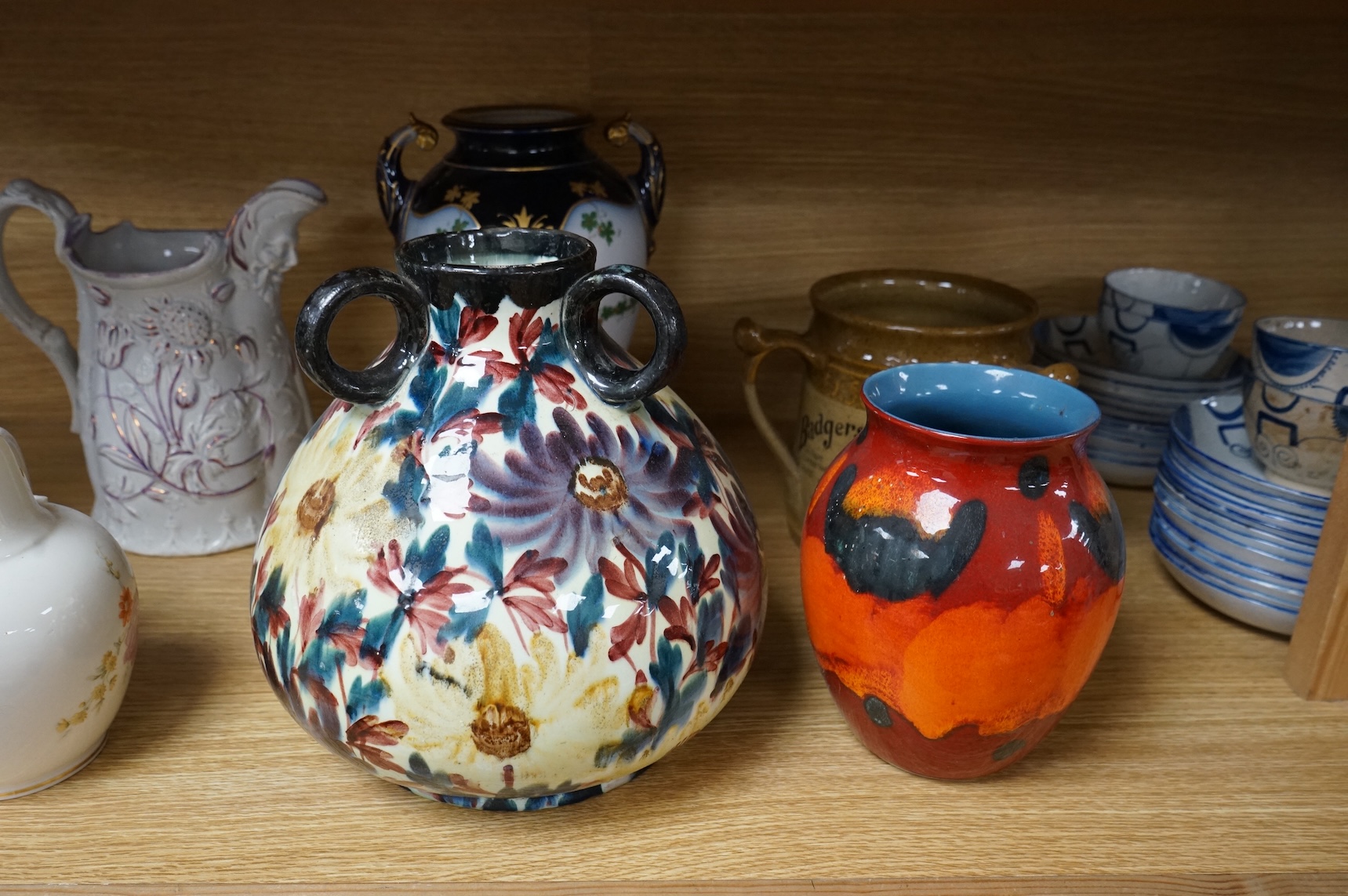 A collection of seven various ceramic vessels including Bretby, Poole, Worcester, continental art pottery etc. 26cm